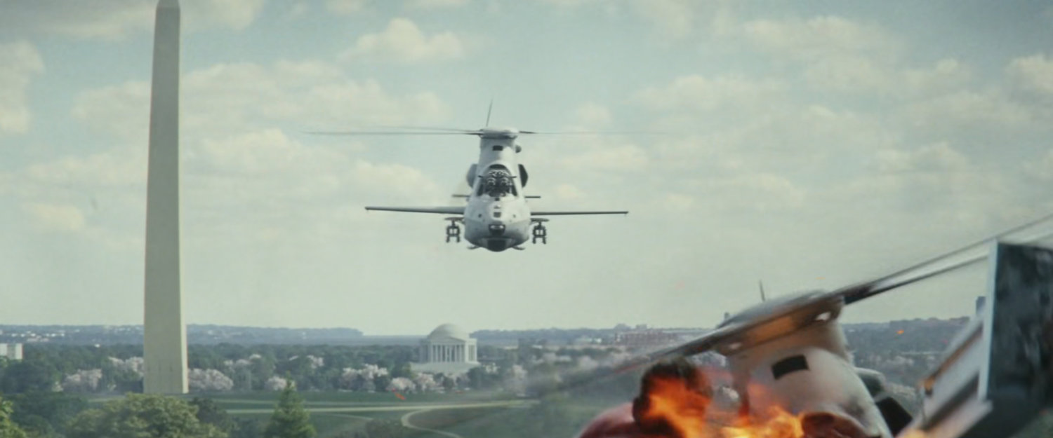 Helicopters flying away from Washington Monument.