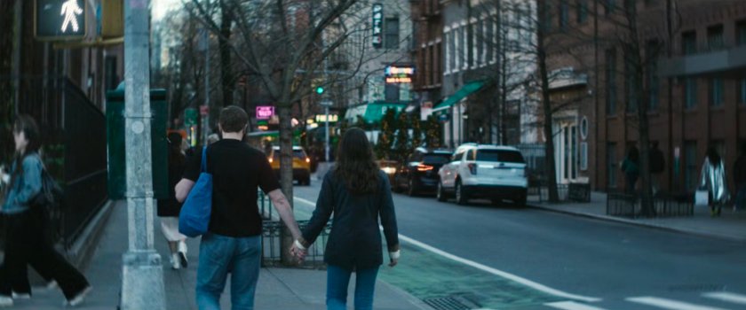 Interstitial: couple walking along sidewalk