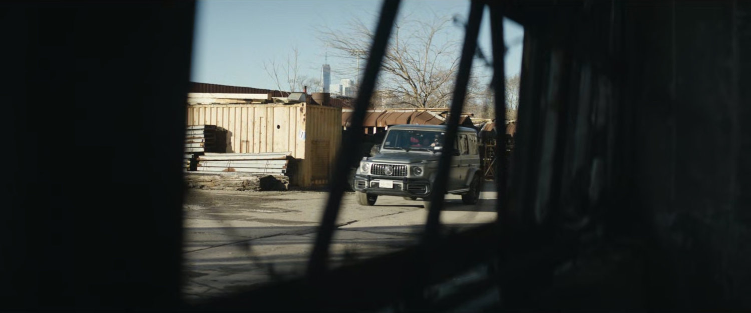 Jeep pulling up to abandoned grain terminal.