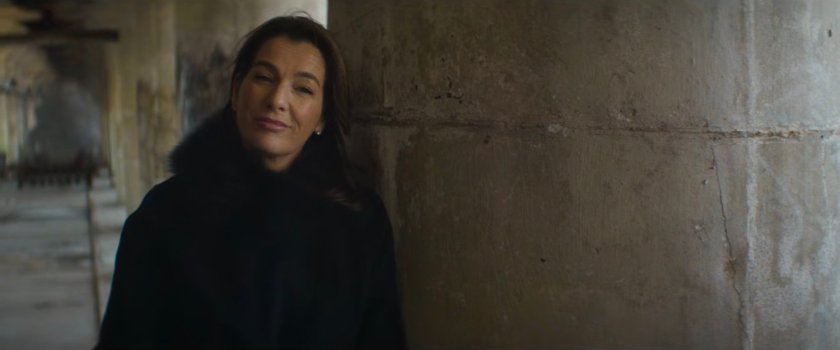 Vanessa leaning against a column in abandoned grain terminal.