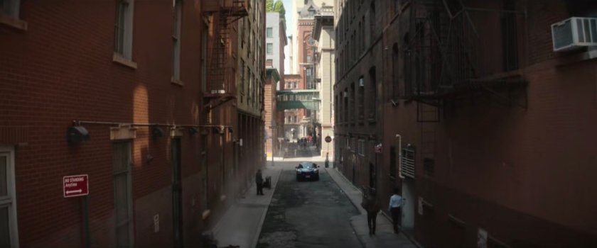Police car driving through alley near Heather's office.