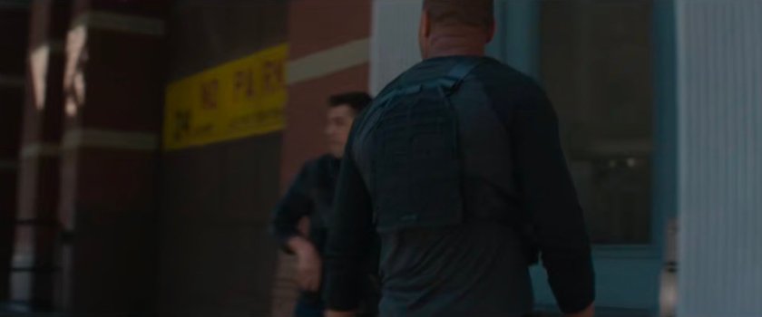 Powell and North about to enter Heather's office building.