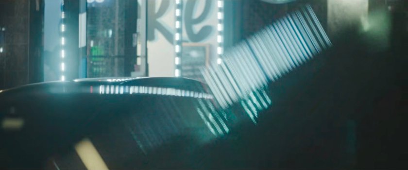 Interstitial: deep focus of pedestrians across street with traffic crossing.