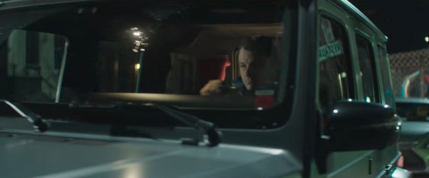 Luca parked outside some buildings.