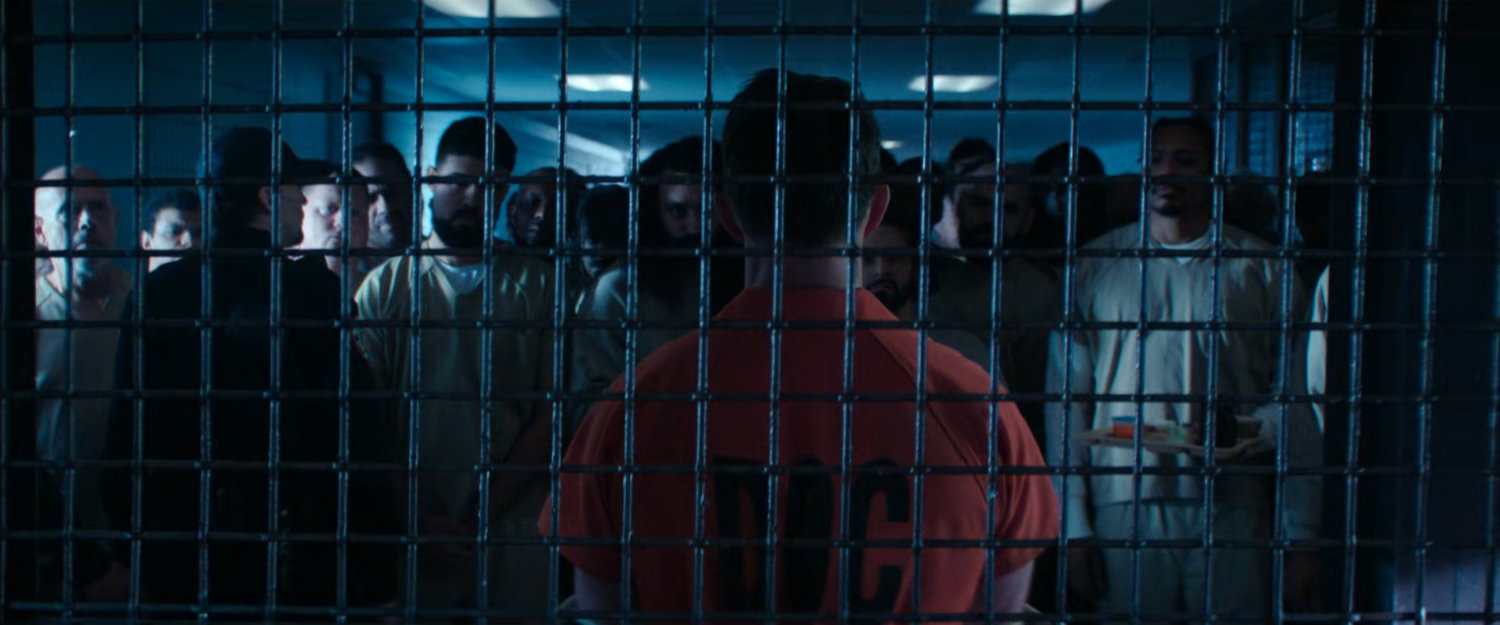 Dex behind bars in GenPop at Ryker's Island Penitentiary.