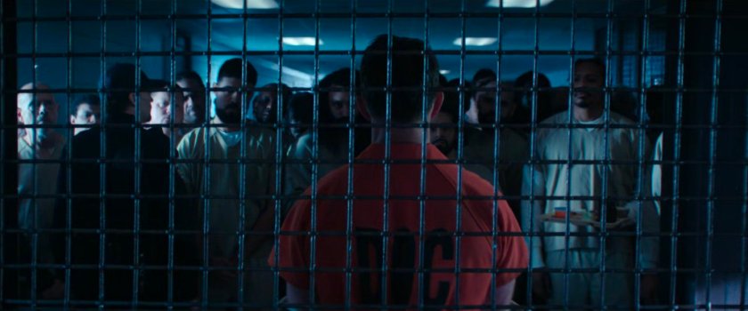 Dex behind bars in GenPop at Ryker's Island Penitentiary.