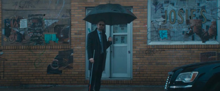 Matt with an umbrella outside Josie's bar.