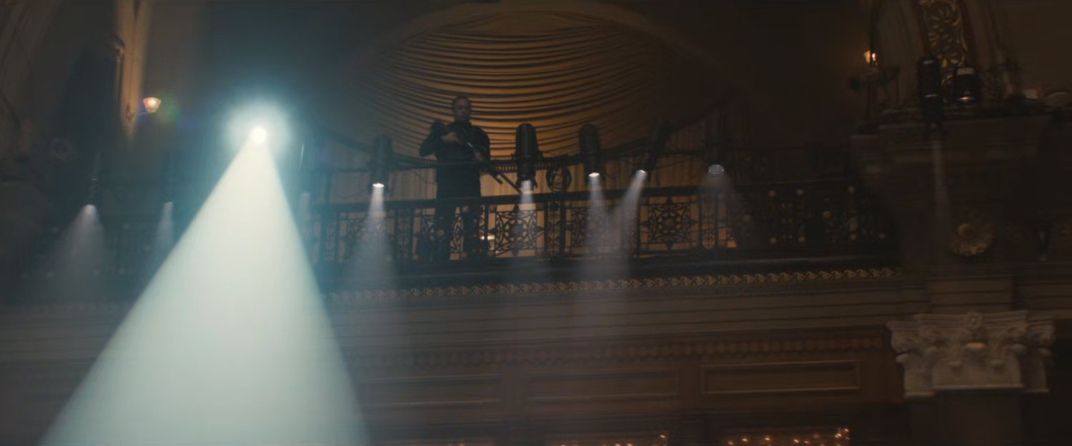 A sniper guard on a balcony at the Black & White Ball.