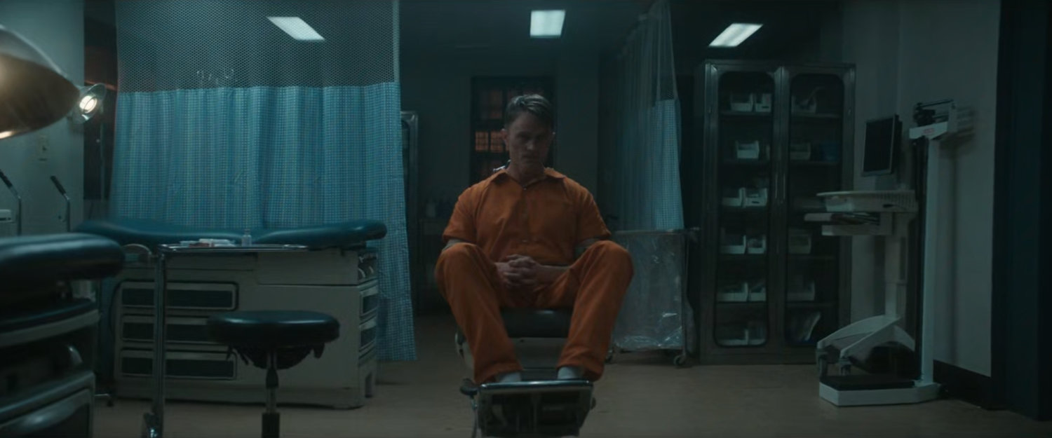 Dex in the hospital at Ryker's Island Penitentiary.