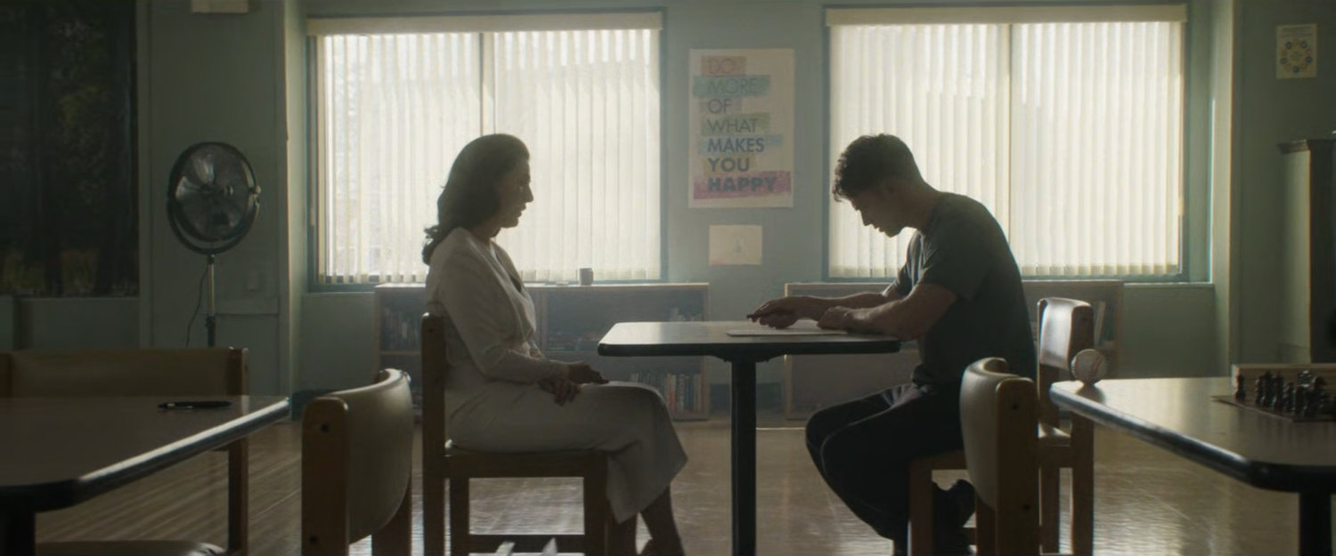 Vanessa and Dex in a psychiatric hospital common room.