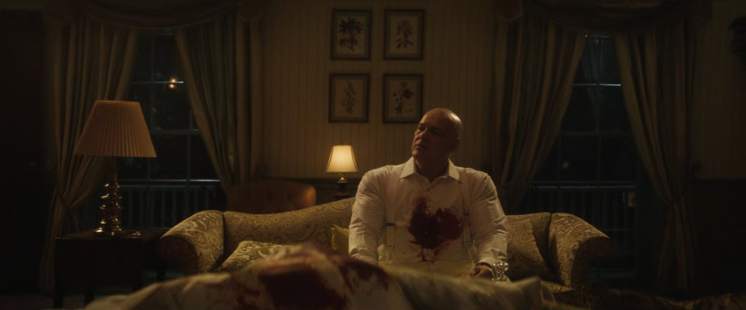 Wilson Fisk with a bloody shirt in his bedroom.