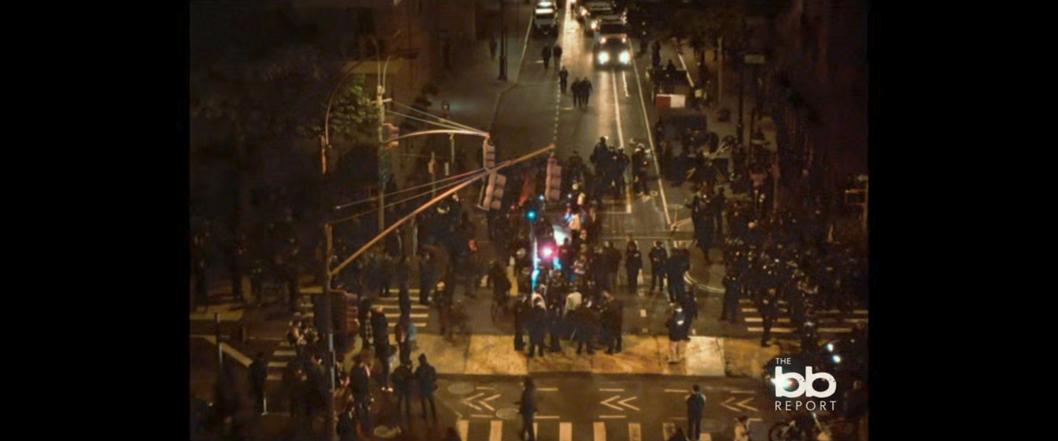 BB Report: high angle footage of police and rioters in intersection.