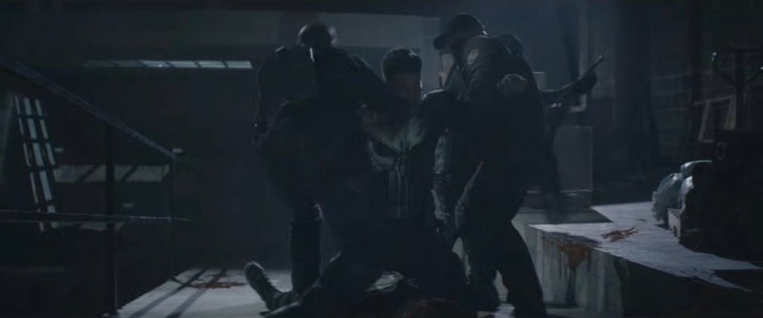 Task Force officers battle The Punisher in the Red Hook port building.