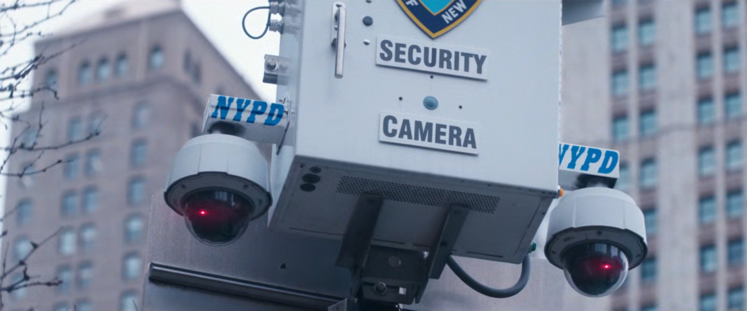 Interstitial: close-up of NYPD security camera.
