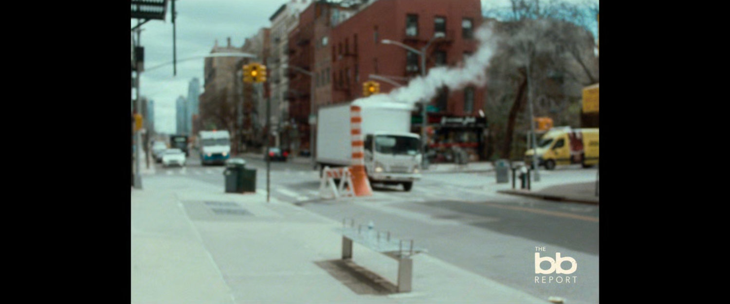 BB Report: truck passing a construction pylon.