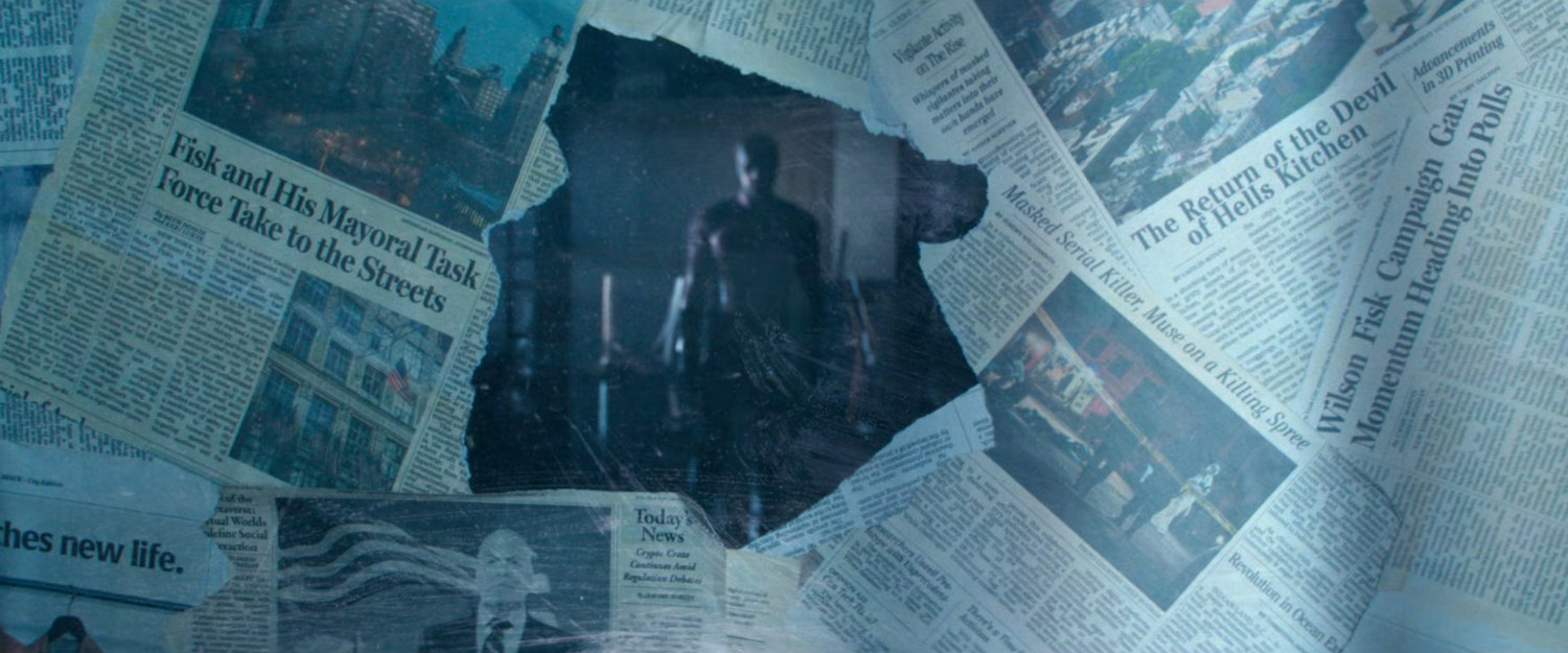 Daredevil seen through a newspaper covered window.