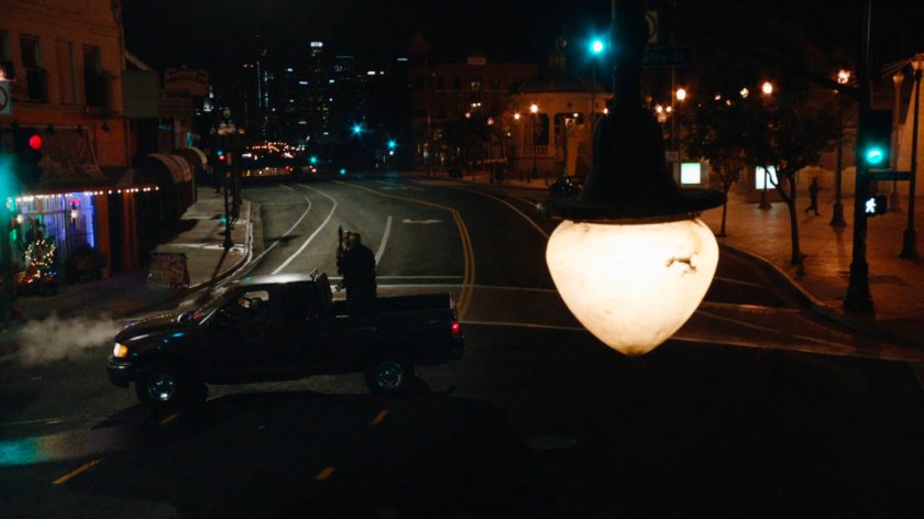 High angle of Watchdog pickup truck in intersection.