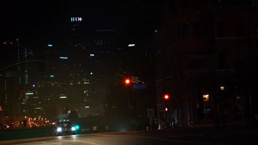 Ghost Rider's car driving along dark Los Angeles street.