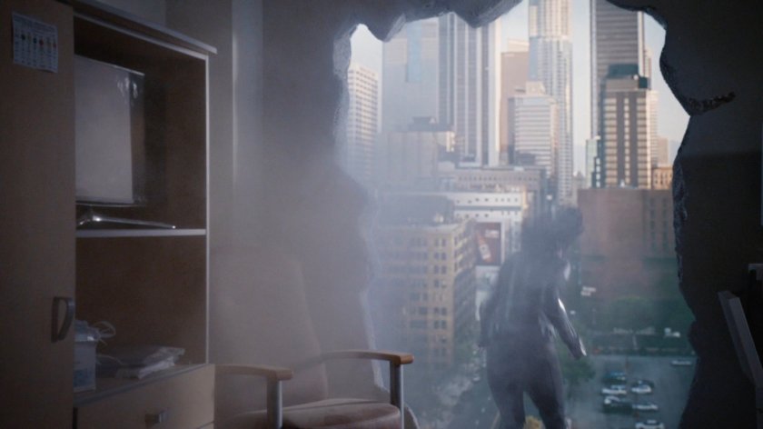 Daisy leaping from hole in side of hospital room wall.