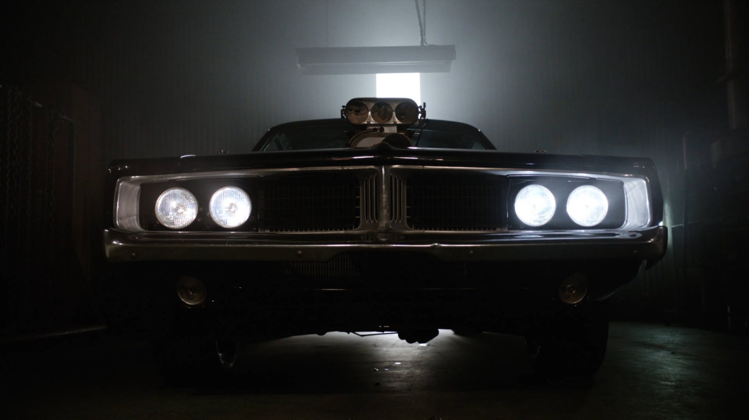 Robbie's Hell Charger inside a garage.