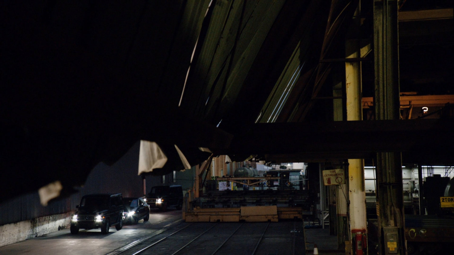 Vehicles arriving outside Cosmogenic Manufacturing.