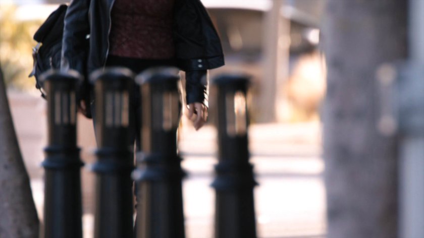 Yo-Yo on a sidewalk street corner.