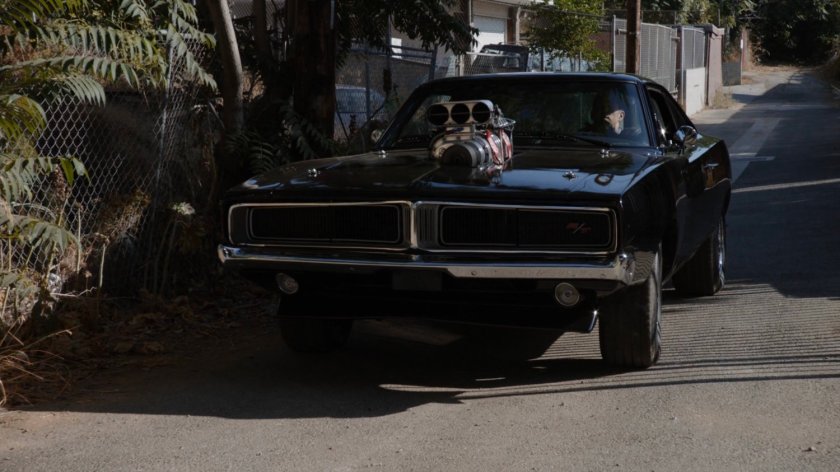 Robbie in his black Charger in the alley behind his house.