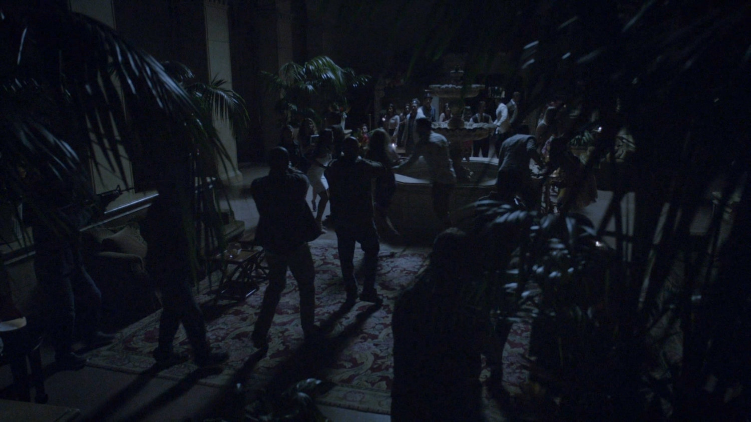 People in blacked out Miami hotel lobby.