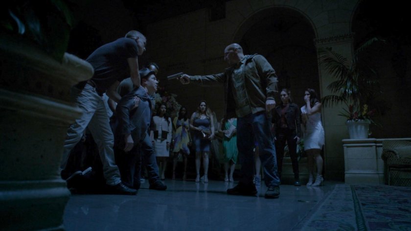 Watchdog holds gun on people in blacked out Miami hotel lobby.