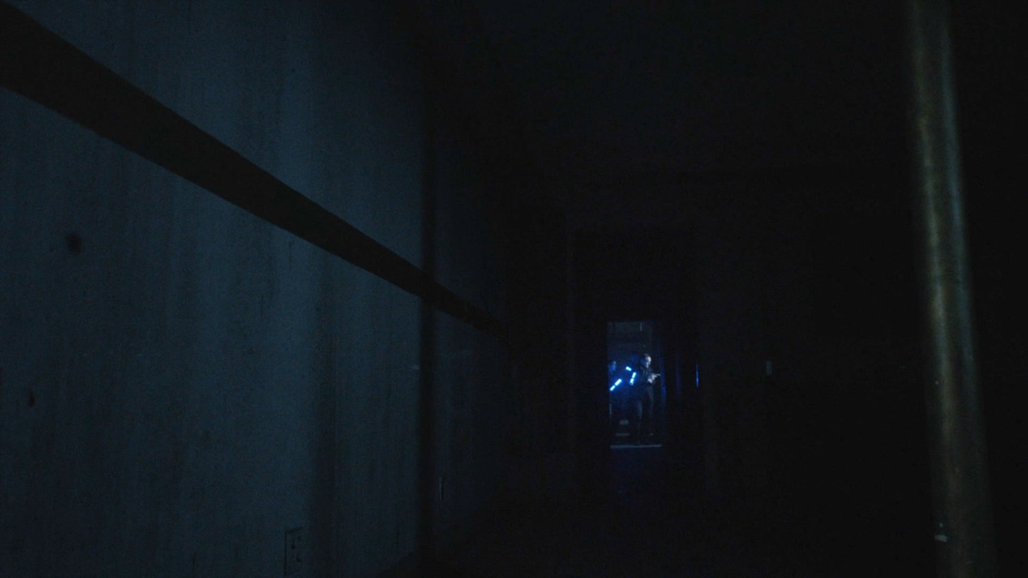 SHIELD Agents in blacked out hallway.