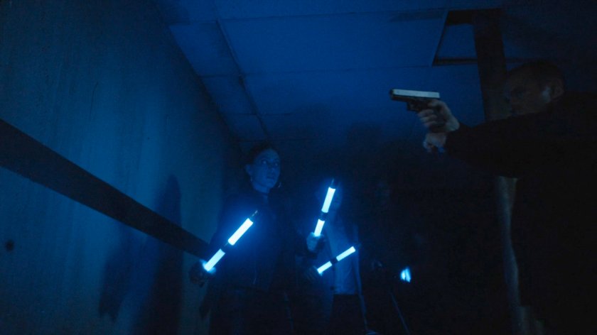 SHIELD Agents in blacked out hallway.