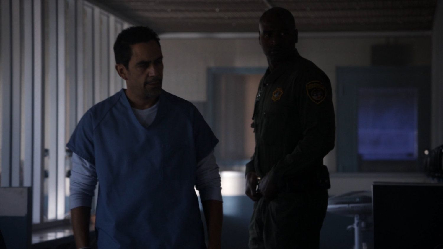Eli Morrow and Guard in visitor room at South Ridge Penitentiary.