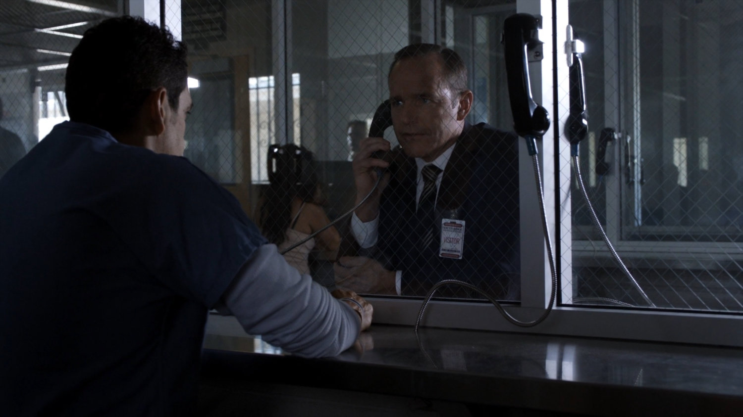 Eli and Coulson in visitor room at South Ridge Penitentiary.