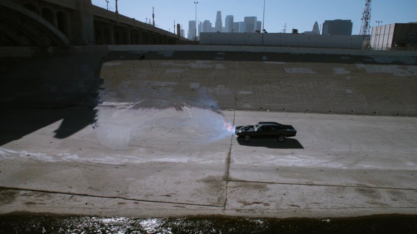 Black Charger crashing into invisible quinjet.