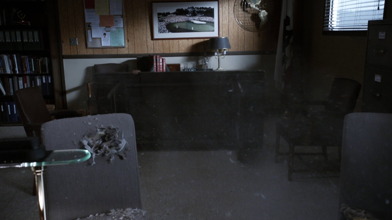 Coulson and May diving behind table in Warden Green's office at South Ridge Penitentiary.