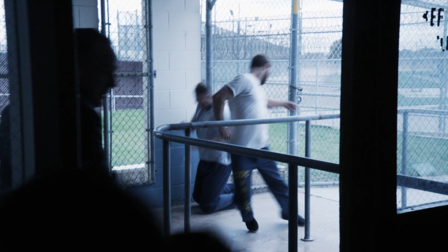 Prisoners running into the cafeteria at South Ridge Penitentiary.