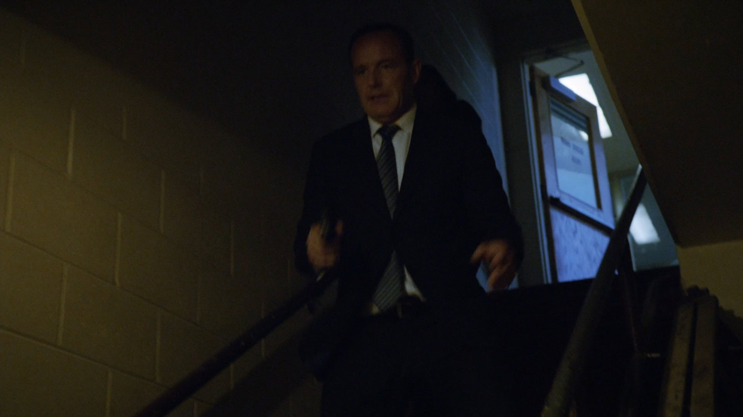 Coulson and May run down stairs in South Ridge Penitentiary.