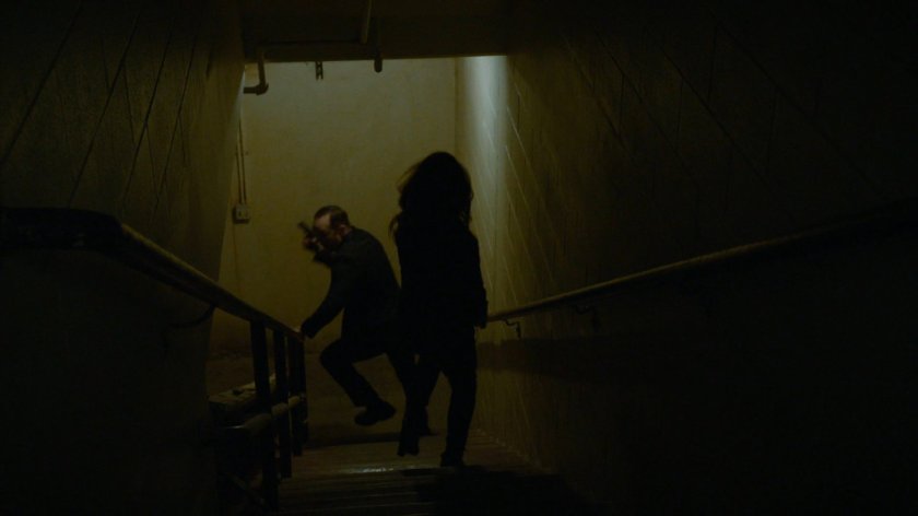 Coulson and May run down stairs in South Ridge Penitentiary.