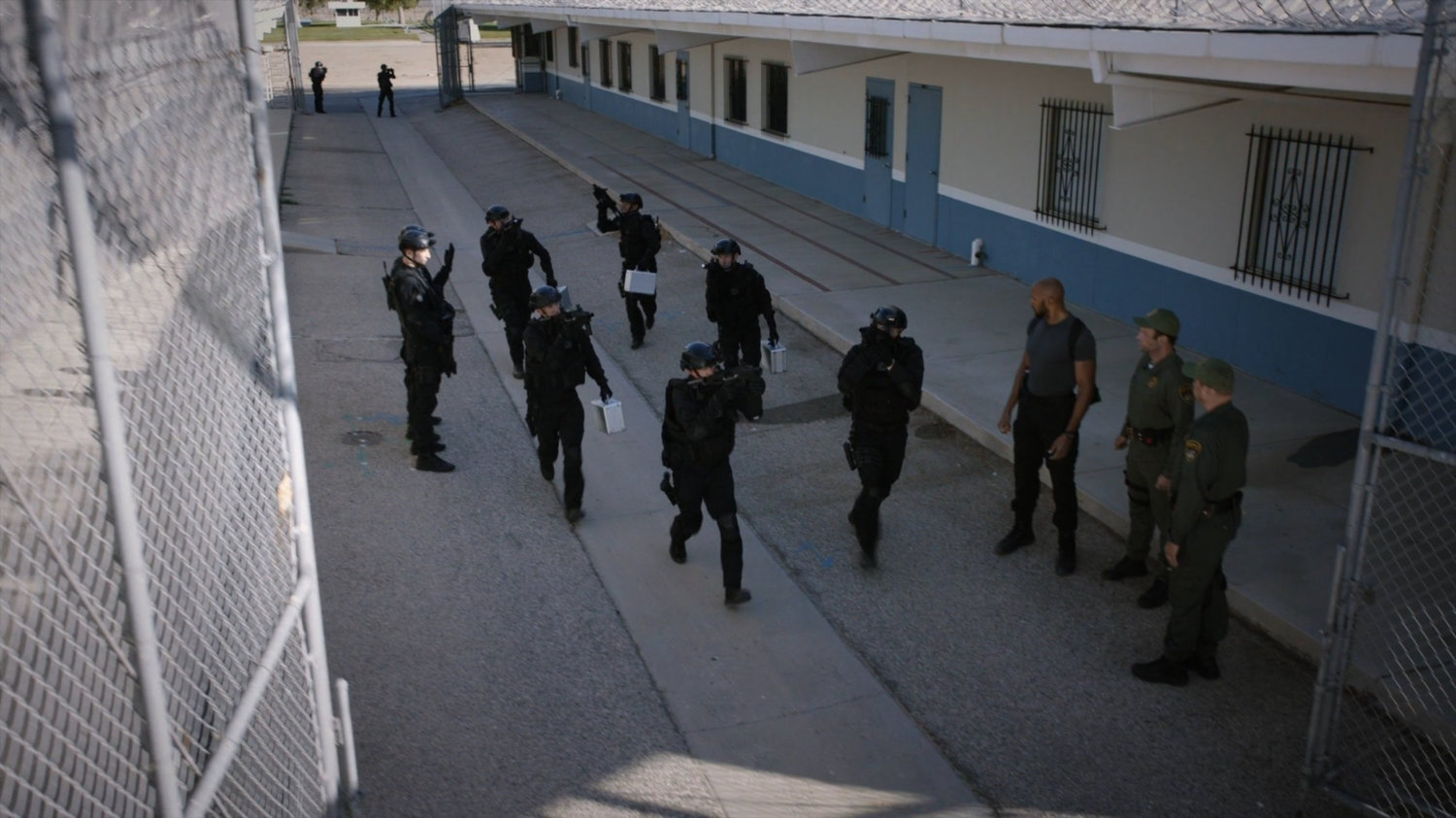 SHIELD agents and police outside South Ridge Penitentiary.