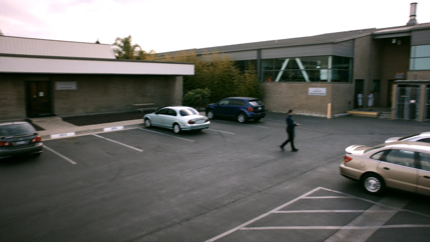 Cars in parking lot of Momentum Labs.