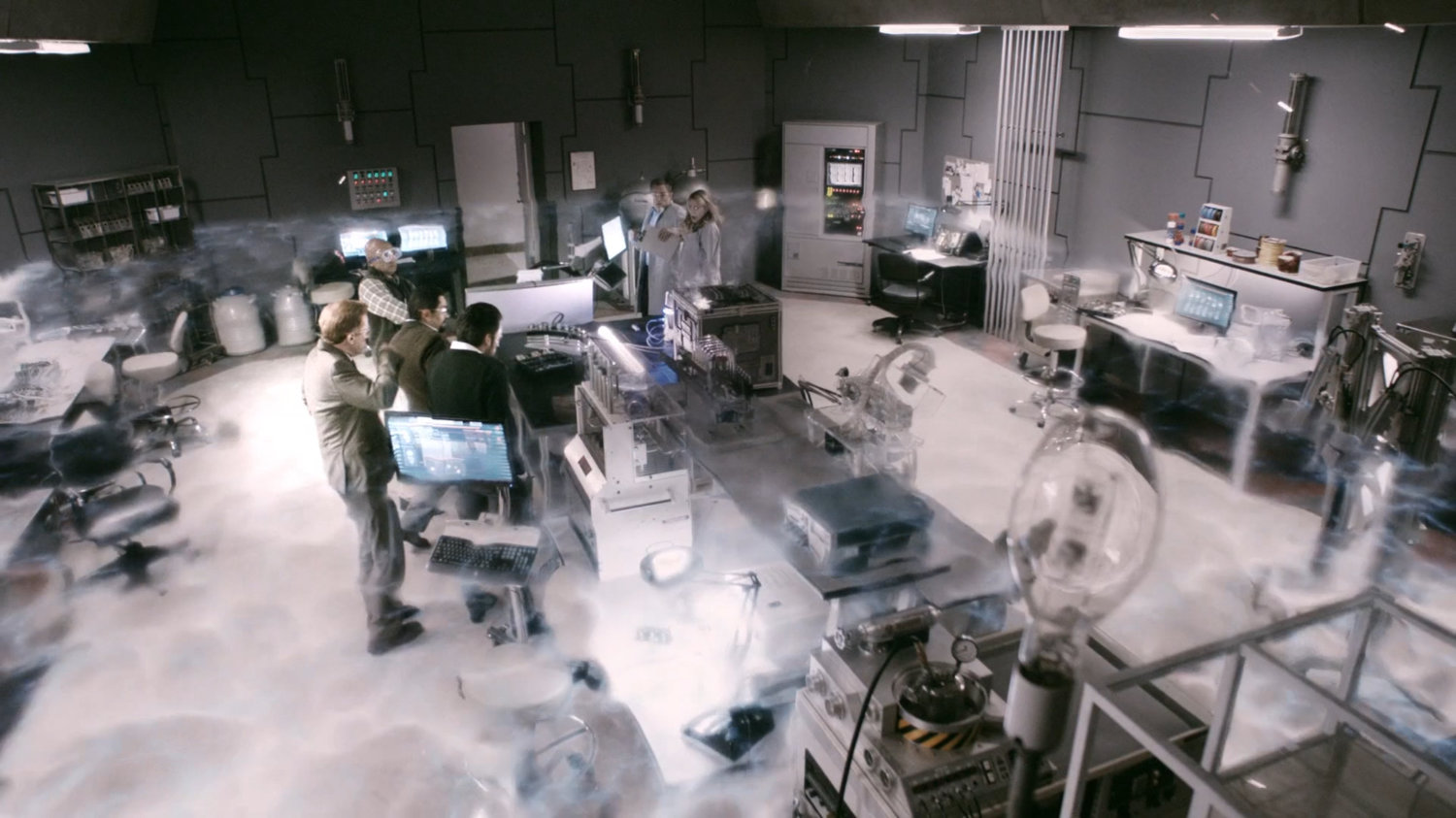 A shock wave passes by scientists gathered in Momentum Labs.