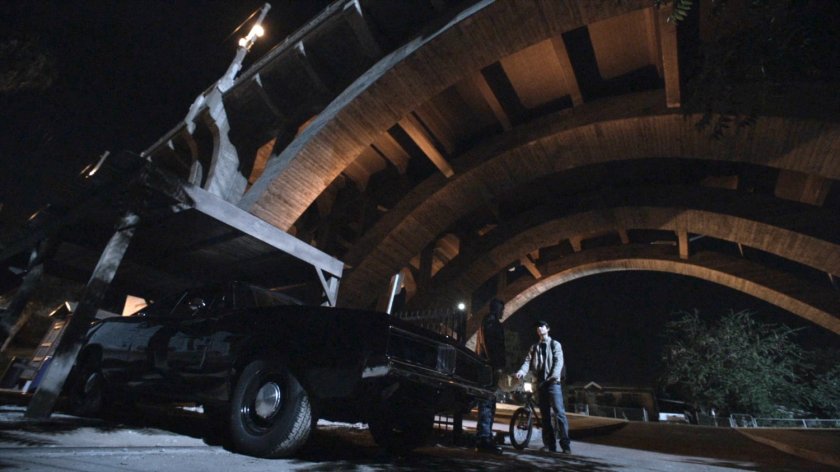 Robbie and Gabe by black Charger under bridge behind Reyes house.