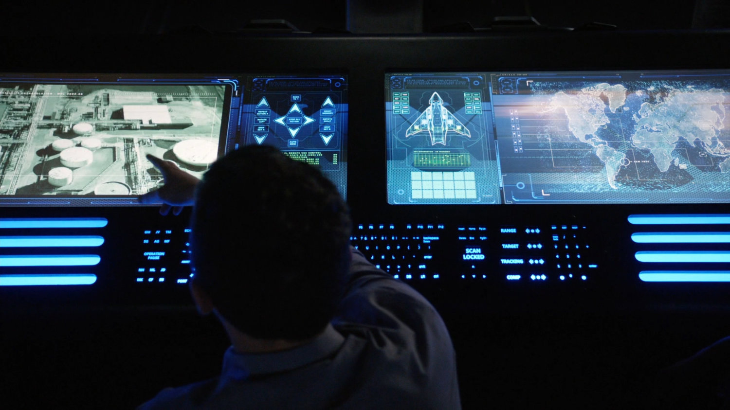 Fitz pointing at computer screen showing satellite view of Roxxon Power Plant