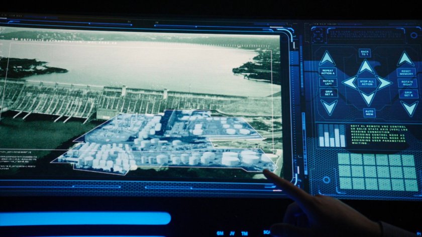Fitz pointing at computer screen showing satellite view of Roxxon Power Plant.