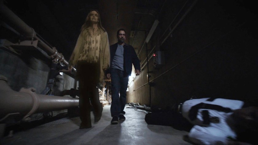 Eli and Lucy walking through Roxxon Power Station corridor.