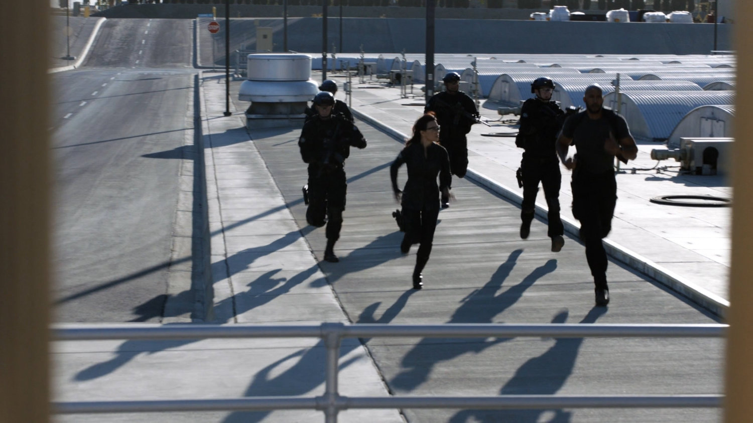 Mack, May and STRIKE team running outside Roxxon Power Station.