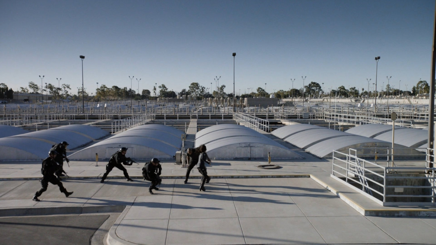 Mack, May and STRIKE team running outside Roxxon Power Station.