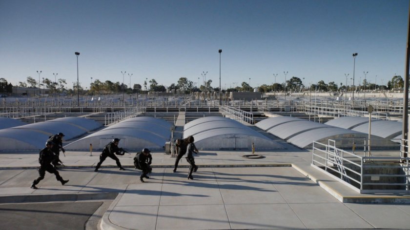 Mack, May and STRIKE team running outside Roxxon Power Station.