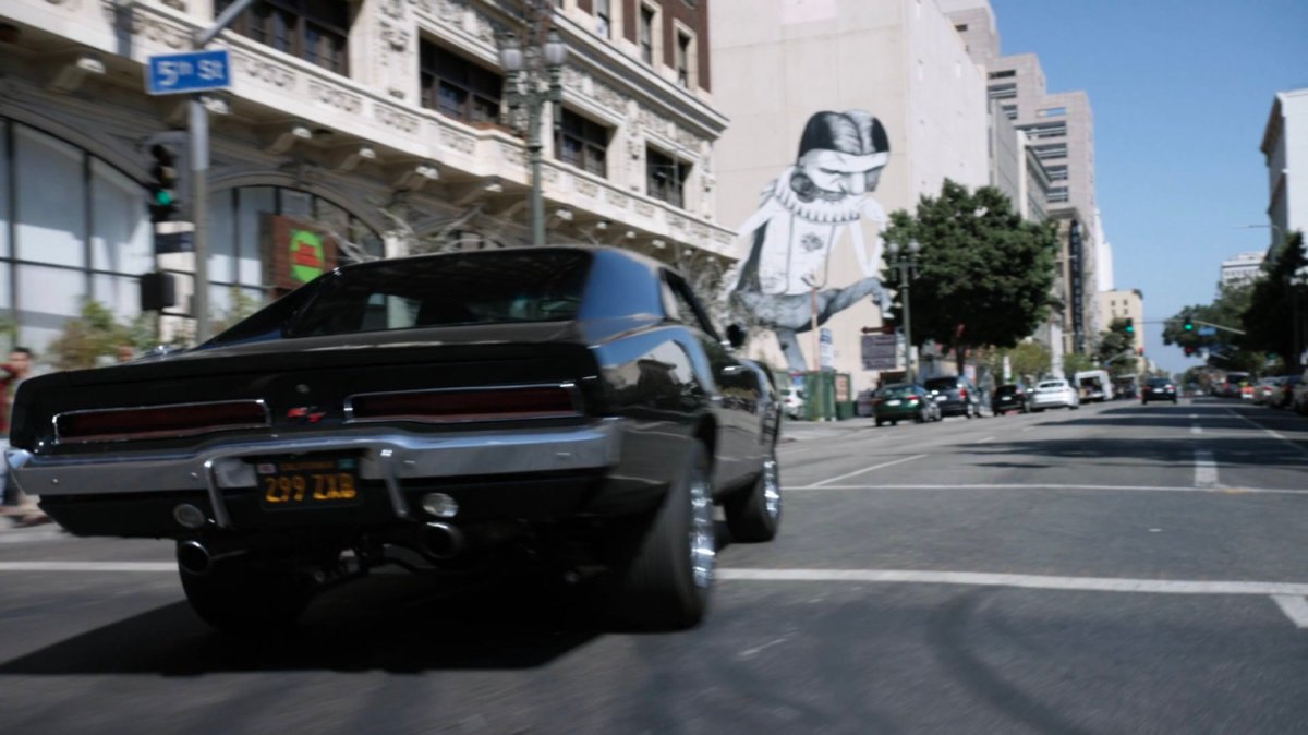 Black Charger taking a corner in Los Angeles.