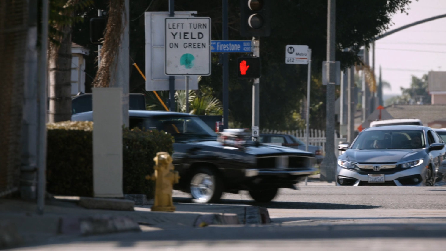Black Charger taking a corner outside the Chinatown Crew Warehouse.
